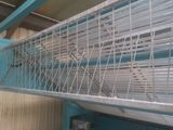 a bird cage that is hanging from the ceiling