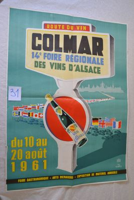 a poster on the wall of a building advertising a tour