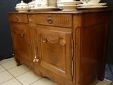 a picture of a wooden cabinet with dishes on top of it