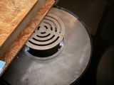 a large metal pan sitting on top of a wooden table