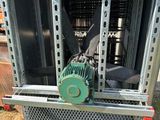 a machine that is sitting on the ground in the grass