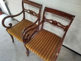two chairs that are next to each other on the floor