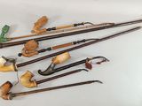 many different types of smoking pipes on a white surface