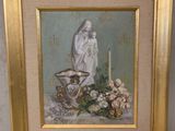 tableau représentant une femme avec une bougie et des fleurs, dans un cadre doré