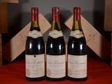 three bottles of wine sitting next to each other on a table