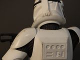 a star wars action figure of a stormtrooper holding a gun