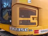 a yellow bulldozer that is parked on the side of the road