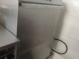 a silver oven sitting in the corner of a kitchen