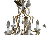 a chandelier that has a bunch of lights hanging from it