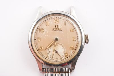a watch that is sitting on a white surface