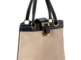 un sac à main beige et noir sur fond blanc