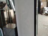 a refrigerator that is sitting in the middle of a room
