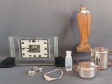 a silver clock, a silver teapot, a silver teapot, a silver teapot, a silver teapot, a silver teapot and a