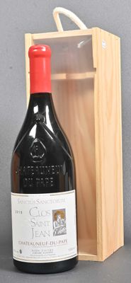 a bottle of wine in a wooden box next to a bottle of wine