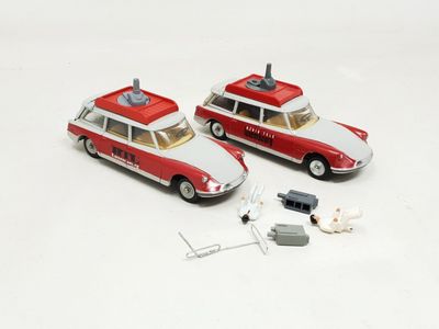 two toy cars that are sitting next to each other
