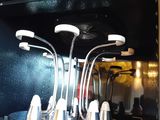 a close up of a stove with a bunch of utensils in it
