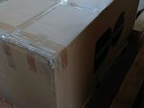 a large box sitting on top of a pallet in a room