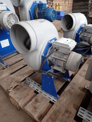 three blowers sitting on a pallet in a warehouse