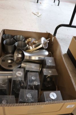 a cardboard box filled with a variety of kitchen utensils