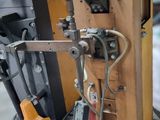 a picture of a machine that is working on a piece of wood