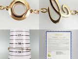a picture of a gold bracelet and a gold bracelet on a table
