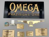 une pancarte sur laquelle est écrit « omega prasisons uhr »