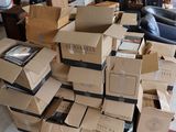 many boxes stacked on top of each other in a living room