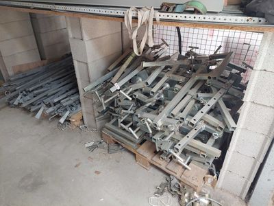 a large pile of metal and wood in a garage