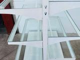 a glass display case that is sitting on the floor