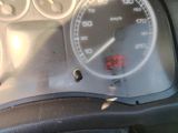 a close up of a car dashboard with a speedometer