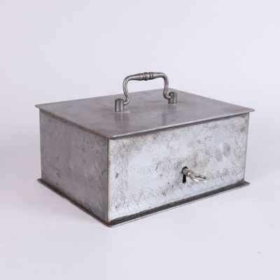 an image of a metal box with a lock on top of it