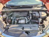 the engine of a car with its hood open and the hood down