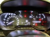 a close up of a car dashboard with a speedometer and gauges