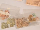 a lot of stamps in a bag on a table