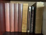 many books that are on a shelf in the room