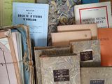 many books that are sitting on a table together