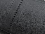the black leather wallet is open and ready to be used