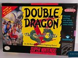 the box for the game double dragon is shown on the table