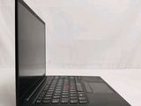 a black laptop with a red button on the screen