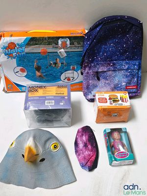 a bag with a mask and other items on a table