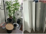 two pictures of a room divider with a fan and a table