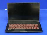 an open laptop computer sitting on top of a blue surface