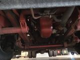 a close up view of the underside of a semi truck