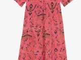 a pink dress with a floral pattern and a v neckline
