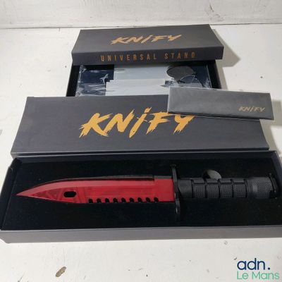 a knife that is in a box with a knife in it
