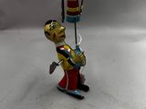 toy figurine of a fireman with a fire hydrant in his hand