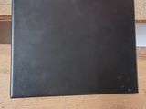 a picture of a laptop on a wooden table