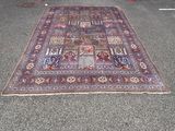 a large oriental rug in front of a garage door