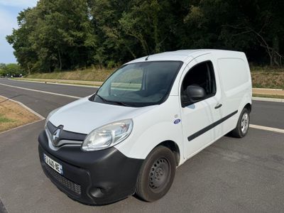 a white van that is parked on the side of the road