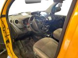 a small yellow car with a steering wheel and dashboard